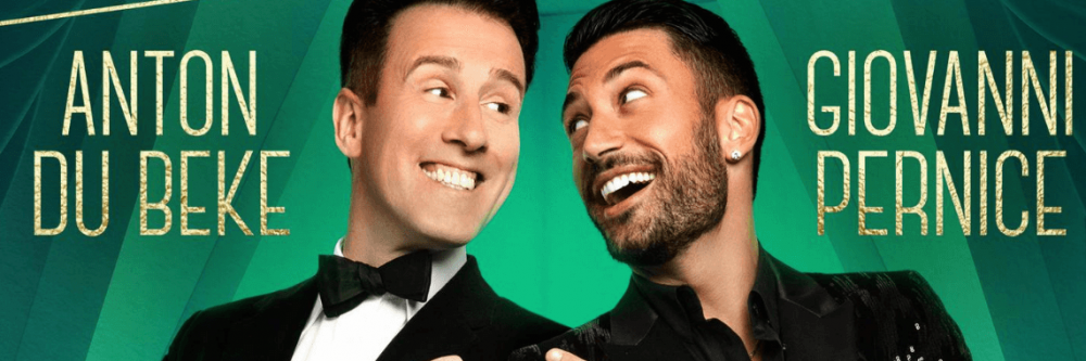 Anton Du Beke and Giovanni Pernice leaning backwards shoulder to shoulder, pointing and looking at each other.